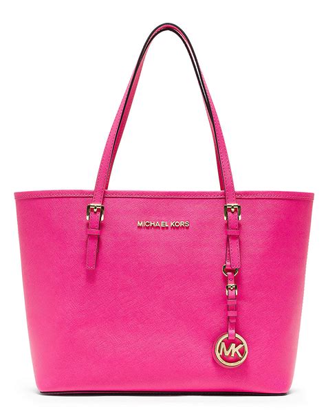 michael kors pink suitcases.